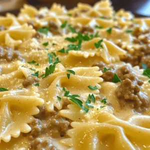 - 8 oz bowtie pasta - 1 lb ground beef - 1 medium onion, finely chopped - 3 cloves garlic, minced - 1 cup heavy cream - 1 cup beef broth - 1 teaspoon Italian seasoning - 1/2 teaspoon red pepper flakes (optional) - 1/2 cup grated Parmesan cheese - Salt and pepper to taste - Fresh parsley, chopped (for garnish) The main ingredients for creamy beef bowtie pasta are simple but key. You need bowtie pasta, ground beef, and a medium onion. These ingredients give the dish its heart and flavor. Then, you enhance the meal with a few additional ingredients. Minced garlic adds a nice aroma. Heavy cream makes the sauce rich and smooth. Beef broth adds depth to the flavor. Italian seasoning brings out the herbs. If you like heat, add red pepper flakes. Parmesan cheese gives it a savory finish. Finally, season with salt and pepper to your taste. Garnish with fresh parsley for a pop of color. This dish is a wonderful blend of flavors and textures. Each ingredient plays its part. You can find the full recipe to guide you through the cooking process. Enjoy crafting this delightful dinner! - Boil salted water in a large pot. - Add the bowtie pasta and cook until al dente. - This takes about 8 to 10 minutes. - Drain the pasta and save 1/2 cup of the water. - Heat a large skillet on medium heat. - Add the ground beef to the skillet. - Cook until the beef is browned, about 5 to 7 minutes. - Break the beef apart with a spatula while it cooks. - Drain any extra fat from the skillet. - Add the chopped onion to the beef. - Sauté until the onion is soft, about 3 to 4 minutes. - Stir in the minced garlic and cook for 1 to 2 minutes. - Pour the beef broth into the skillet. - Bring the broth to a simmer. - Stir in the heavy cream slowly. - Add 1 teaspoon of Italian seasoning. - If you like heat, add 1/2 teaspoon of red pepper flakes. - Season the sauce with salt and pepper to taste. - Let the sauce simmer for 5 minutes, stirring often. - The sauce should thicken slightly. Now, you can combine the cooked bowtie pasta with the creamy sauce. For the full recipe, check the earlier sections. Enjoy your cooking! To make your sauce truly creamy, always use whole heavy cream. It gives the best texture. You want that rich, velvety feel in each bite. If your sauce gets too thick, don’t worry! Gradually add some of the reserved pasta water. This water is starchy and helps loosen the sauce while keeping it creamy. To boost the flavor, try adding herbs like basil and oregano. They can brighten up the dish. You can also swap out heavy cream for half-and-half if you want a lighter sauce. This still gives a nice creaminess but cuts some calories. Experiment with these tips to find your perfect taste! If you want to check out the full recipe, click here. {{image_2}} When you want to change up your creamy beef bowtie pasta, there are many fun options. You can make this dish your own with simple swaps and additions. - Add spinach for a pop of color and nutrients. - Chopped bell peppers bring a sweet crunch and bright flavor. - If you want a leaner option, swap ground beef for ground turkey or chicken. This change keeps the meal healthy and tasty. - Bowtie pasta is great, but other shapes work too. Try penne or fusilli for a new texture. - If you have dietary needs, gluten-free pasta is available. Many brands offer tasty options that cook well. These easy variations let you mix things up while keeping the dish delicious. For the full recipe, check out the instructions above. Store any leftovers in an airtight container for up to 3 days. This keeps the flavors fresh and the pasta tasty. When you are ready to eat, simply reheat it on the stove or in the microwave. If you find the sauce too thick after refrigeration, just add a splash of water or milk to bring back the creaminess. You can freeze portions in freezer-safe containers for up to 2 months. Just let the pasta cool completely before you freeze it. When you are ready to enjoy, reheat gently. This helps maintain the creamy texture. To reheat, place it in a skillet over low heat. Stir often and add a bit of milk or broth to keep it smooth. You can prep the ingredients in advance. Cook the pasta and store it separately. You can also brown the beef and sauté the onion and garlic ahead of time. Mix them with the sauce before serving. Keep everything in the fridge. When ready to eat, just heat it up and mix! Yes, you can use half-and-half or sour cream. Both will change the texture. Half-and-half makes the sauce lighter, while sour cream adds a tangy taste. If you want a dairy-free option, use coconut cream or cashew cream. They will make the dish creamy, but with a different flavor. You can serve a fresh salad with greens and veggies. Garlic bread is a great side too. Roasted or steamed vegetables like broccoli or green beans also work well. These sides balance the creamy pasta and add some color to your meal. You learned how to make Creamy Beef Bowtie Pasta. We covered all ingredients, steps, and tips. Remember to play with flavors and try new ingredients. Store leftovers properly for future meals. You can even make this dish ahead of time for ease. Enjoy the creamy goodness and share this recipe with others. Cooking should be fun and tasty. Happy cooking!