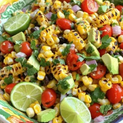 For this recipe, use 4 ears of fresh corn. Husk them well to remove all the silk. Fresh corn adds a sweet and juicy flavor to the salad. Grilling the corn gives it a nice char, which enhances its taste. You will need several vegetables to add color and crunch. Gather these: - 1 red bell pepper, diced - 1 green bell pepper, diced - 1 small red onion, finely chopped - 1 cup cherry tomatoes, halved - 1 avocado, diced - 1 cup black beans, rinsed and drained - ½ cup fresh cilantro, chopped These vegetables bring bright colors and fresh flavors. The avocado adds creaminess, while the black beans add protein and texture. The dressing ties everything together. You will need: - 2 tablespoons olive oil - 2 tablespoons lime juice - 1 teaspoon chili powder - Salt and pepper to taste This dressing is simple but full of flavor. The lime juice adds a zesty kick, while the chili powder gives it a little heat. Mix these ingredients well to coat the salad perfectly. For the full recipe, check out the detailed instructions. First, heat your grill to medium-high. Place the husked corn directly on the grill. Grill the corn for about 10-15 minutes. Turn it occasionally until you see slight char marks. This adds a nice smoky flavor. Once done, take the corn off the grill and let it cool. Use a sharp knife to cut the kernels off the cobs into a large bowl. Now, you can prepare the salad. Add the diced red bell pepper, green bell pepper, and finely chopped red onion to the bowl with the corn. Next, toss in the halved cherry tomatoes and diced avocado. Don't forget to add the rinsed black beans and chopped cilantro. These ingredients make the salad colorful and fresh. In a small bowl, it's time to make the dressing. Whisk together the olive oil and lime juice. Add the chili powder, salt, and pepper to the mix. This simple dressing will bring all the flavors together. Pour the dressing over the salad mixture. Gently toss everything together until well combined. Taste your salad and adjust the seasoning if needed. Serve it right away or chill it for 30 minutes. Chilling helps the flavors meld together. For a vibrant look, serve in a large bowl with extra cilantro and lime wedges on the side. You can find the full recipe [here](#). For a great grilled corn salad, always pick fresh corn. Look for ears with bright green husks. The silk should be golden and slightly sticky. Press your thumb on a kernel; it should feel firm and juicy. Sweet corn is the best choice for flavor and texture. If you can, buy it the same day you plan to grill it. Fresh corn makes a big difference in taste. To boost the flavor of your salad, try roasting the peppers and onion. This adds a nice smoky taste. You can also add spices like cumin or smoked paprika for depth. A touch of honey in the dressing can balance the lime juice's tartness. Experiment with herbs like basil or parsley for a fresh twist. Each change can make your salad unique and fun. Presentation matters! Serve your salad in a big, colorful bowl. Garnish with extra cilantro and lime wedges. This adds a bright touch and invites people to dig in. You can also serve it in small cups for parties. This way, everyone gets their own serving. Adding a drizzle of olive oil on top just before serving makes it look fancy. A good presentation makes the dish more appealing. {{image_2}} You can easily add protein to your grilled corn salad. This boosts flavor and makes it heartier. Here are some tasty options: - Grilled Chicken: Dice cooked chicken breast and mix it in. - Shrimp: Grill shrimp with some spices for a seafood twist. - Tofu: Use cubed, grilled tofu for a plant-based option. - Cheese: Feta cheese crumbles or cotija add a creamy touch. Each choice pairs well with the fresh flavors in the salad. If you love heat, try making a spicy version. Adding jalapeños can bring a nice kick. Here’s how to spice it up: - Fresh Jalapeños: Dice them finely and mix them in. - Hot Sauce: Drizzle your favorite hot sauce over the salad. - Cayenne Pepper: Sprinkle a bit of cayenne into the dressing. These additions will make your salad exciting and fun to eat. You can change the veggies based on what’s fresh. This keeps your salad interesting year-round. Here are some ideas: - Zucchini: Grate it or dice it for a nice crunch. - Radishes: Add sliced radishes for a peppery bite. - Carrots: Shredded carrots bring sweetness and color. Feel free to mix and match. Experiment with what you have on hand. For the full recipe, check out the detailed instructions above. You can store leftover grilled corn salad in the fridge. Place it in an airtight container. It stays fresh for about 3 days. The flavors meld nicely, but some veggies may soften. If you want crunch, eat it sooner. Freezing this salad is not the best choice. The texture of corn and fresh veggies changes when frozen. If you have too much, consider freezing just the corn. Cooked corn can freeze well for about 6 months. To keep your salad fresh, store it properly. Use a clean container, and keep it covered. If you prepare it ahead of time, add avocado just before serving. This keeps it green and tasty. For the best flavor, enjoy the salad within a few days. For the full recipe, check out the detailed steps above. Yes, you can make grilled corn salad ahead of time. I recommend preparing it up to a day in advance. Just keep it in the fridge. The flavors will mix nicely as it sits. If you prepare it early, wait to add the avocado until just before serving. This keeps it fresh and green. If you don't have black beans, try using pinto beans or kidney beans. They both work well in this salad. You can also use corn for extra crunch. Chickpeas are another great option. They add a nice texture and flavor. Yes, you can grill corn without a grill. You can use a stovetop grill pan or even broil it in your oven. Just preheat your pan or oven. Place the corn on the heat source and watch it carefully. Turn it often for even cooking. This gives you that charred flavor, just like on a grill. In this blog post, we explored how to make a fresh and tasty grilled corn salad. We covered key ingredients like corn, veggies, and dressings, plus easy steps for preparation. I shared tips to choose the best corn and enhance flavors. You can easily swap in proteins or spices for a fun twist. Finally, I discussed storage to keep your salad fresh. Enjoy this dish, and have fun experimenting with flavors!