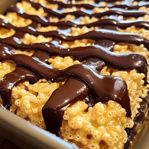 - 3 tablespoons unsalted butter - 1 package (10 oz) mini marshmallows - 6 cups Rice Krispies cereal - 1/2 teaspoon vanilla extract - 1/2 cup semi-sweet chocolate chips - 1 tablespoon coconut oil (for the chocolate drizzle) - Sea salt (optional, for garnish) To make Chocolate Drizzled Rice Krispie Treats, you need simple ingredients. First, gather your main ingredients. You will need unsalted butter, mini marshmallows, Rice Krispies cereal, and vanilla extract. These items form the base of your tasty treats. Next, for the topping, you will need semi-sweet chocolate chips and coconut oil. The coconut oil helps the chocolate melt smoothly. Adding a pinch of sea salt on top gives a nice flavor twist. Using good quality chocolate makes your treats even better. The chocolate drizzle adds a rich taste. It also makes the treats look fancy. You can find the full recipe above. Now, let's get started! Start by melting the butter in a large saucepan over low heat. Once it melts, add the mini marshmallows. Stir them in until they become smooth and creamy. This step is key, as it forms a sticky base for the treats. Next, take the pan off the heat and mix in the vanilla extract. This adds a sweet touch to your rice treats. Now, it's time to add the magic ingredient: Rice Krispies! Gradually pour the cereal into the warm marshmallow mix. Stir gently but quickly to ensure every piece gets coated. The mixture should be sticky but evenly coated. This will help your treats hold together when cut later. Prepare a 9x13 inch baking dish by greasing it with butter or cooking spray. Pour the cereal mixture into the dish. Use a spatula or your hands to press it down firmly and evenly. This step is important to create a solid base. Allow the treats to cool for 15-20 minutes. This helps them set up nicely. While your treats cool, melt the semi-sweet chocolate chips in a microwave-safe bowl. Do this in 30-second intervals, stirring in between until smooth. This keeps the chocolate from burning. Next, stir in the coconut oil to get a nice drizzle consistency. Once your treats are set, use a spoon to drizzle the melted chocolate in a zig-zag pattern over the top. This adds a sweet finishing touch. If you want, sprinkle a little sea salt on top for extra flavor. To get that perfect gooey yet firm Rice Krispie treat, start with fresh marshmallows. Old marshmallows can lose their fluffiness. When you melt the butter, add the marshmallows right after. Stir them well. You want them to melt completely before mixing in the cereal. Once combined, press the mixture into the baking dish firmly. This helps the treats hold their shape. Let them cool at room temperature. If you want to speed up the cooling process, pop them in the fridge for about 10 minutes. Just don&rsquo;t leave them in too long! For a beautiful drizzle design, use a spoon to create zig-zag patterns. Hold the spoon high above the treats when you drizzle. This creates a lovely effect. If you want thicker lines, drizzle the chocolate slowly. When choosing chocolate, semi-sweet is my top pick. It balances well with the sweetness of the marshmallows. You can also use milk chocolate for a creamier taste or dark chocolate for a richer flavor. Melt your chocolate in short bursts in the microwave. Stir between each burst to avoid burning. To boost flavor, consider adding some fun extras. A pinch of cinnamon or a splash of almond extract works wonders. Try folding in mini chocolate chips or crushed nuts into the Rice Krispie mix for added texture. These treats pair well with ice cream. A scoop of vanilla or chocolate ice cream makes a great match. You can also serve them with fresh fruit like strawberries or bananas. This adds freshness and balances the sweetness. For the full recipe, check out the complete instructions above. {{image_2}} You can switch up the chocolate for your drizzle. Milk chocolate gives a sweet, creamy taste. Dark chocolate adds a rich depth that many love. If you want something different, try white chocolate. It melts beautifully and looks great on top. You can also mix chocolates for a fun flavor twist. Want to jazz up your treats? Add some nuts like chopped almonds or pecans for crunch. Dried fruits like cranberries or raisins can add a chewy texture and sweetness. If you want to try something new, use other cereals. Cheerios or Cornflakes can work well. They add a unique twist to the classic Rice Krispies. Make your treats seasonal! For holidays, add colorful sprinkles. Red and green for Christmas or pastel colors for Easter. You can also match colors for birthday parties. Use food-safe dye to color your drizzle. This makes your treats fun and festive for any event. Get creative and let your imagination run wild! For the full recipe, check out the Chocolate Drizzled Rice Krispie Treats section. To keep your chocolate drizzled Rice Krispie treats fresh, store them in an airtight container. This helps prevent them from drying out or becoming hard. If you don&rsquo;t have an airtight container, wrap the treats tightly in plastic wrap. - Use a container that fits the size of your treats. A smaller container reduces air exposure. - Keep the container in a cool, dry place away from sunlight. High heat can change the texture. At room temperature, these treats stay fresh for about 3 days. If you want to keep them longer, freezing is a great option. - To freeze, cut the treats into squares and place them in a single layer on a baking sheet. - Once frozen, transfer them to a freezer-safe bag or container. When you want to enjoy them, thaw the treats at room temperature for about 30 minutes. They will taste just as good! Can I use gluten-free Rice Krispies? Yes, you can use gluten-free Rice Krispies. Many brands offer gluten-free options. Check the label to ensure they meet your needs. How do I make these treats crispy rather than sticky? To keep your treats crispy, avoid overmixing the Rice Krispies. Also, let them cool completely before cutting. This helps them maintain their crunch. What can I substitute for butter or marshmallows? You can use coconut oil instead of butter. For marshmallows, try using a vegan alternative made from agar or other plant-based ingredients. Can I double the recipe easily? Yes, you can double the recipe. Just use a larger baking dish and keep an eye on the cooling time. Why did my drizzle not set? If your drizzle does not set, it may need more coconut oil. Try adding a bit more and allowing it to cool longer. What to do if the treats are too hard? If your treats are too hard, add a bit of water or milk to the mixture next time. This keeps them soft and chewy. You learned how to make classic Rice Krispie treats with a chocolate drizzle. We covered key ingredients, step-by-step instructions, tips for texture, variations, and storage. Keep your treats fresh and tasty with these simple methods. Enjoy experimenting with flavors and toppings. These treats are fun to make and share. Whether for a party or a quiet night, they bring joy. Try your best, and you&rsquo;ll create something delicious. Enjoy your sweet treat journey!