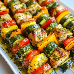 For these tasty skewers, gather the following main ingredients: - 1 lb chicken breast, cut into 1-inch cubes - 1 red bell pepper, cut into 1-inch pieces - 1 yellow bell pepper, cut into 1-inch pieces - 1 medium zucchini, sliced into thick rounds These ingredients form the base of our dish. The chicken gives protein, while the veggies add crunch and color. The chimichurri sauce is key to this dish. Here are the ingredients you need for the sauce: - 1/4 cup olive oil - 1 tablespoon red wine vinegar - 1 cup fresh parsley, chopped - 1/4 cup fresh cilantro, chopped - 3 cloves garlic, minced - 1 teaspoon red pepper flakes (adjust to taste) - Salt and pepper to taste This sauce adds a fresh and zesty flavor. The herbs give it brightness, while the garlic adds depth. You can customize your skewers with these add-ins: - Cherry tomatoes for sweetness - Mushrooms for earthiness - Onion for extra flavor Feel free to adjust the spices too. You may want to add more red pepper flakes for heat or use lemon juice for a tangy kick. These options help make the dish your own! {{ingredient_image_1}} To start, grab a bowl and whisk together these ingredients: - 1/4 cup olive oil - 1 tablespoon red wine vinegar - 1 cup fresh parsley, chopped - 1/4 cup fresh cilantro, chopped - 3 cloves garlic, minced - 1 teaspoon red pepper flakes - Salt and pepper to taste Mix all these until they blend well. This sauce is zesty and fresh. You will use half for the chicken. Set the other half aside for later. In another bowl, add 1 pound of chicken breast cut into cubes. Pour the reserved chimichurri sauce over the chicken. Make sure each piece gets coated. Cover the bowl with plastic wrap. Let it sit in the fridge for at least 30 minutes. You can leave it longer, up to 2 hours. This helps the flavors soak in. Next, prepare your veggies. Cut 1 red bell pepper and 1 yellow bell pepper into 1-inch pieces. Slice 1 medium zucchini into thick rounds. Toss them in a drizzle of olive oil, salt, and pepper. Now, take your skewers. Thread the marinated chicken, bell peppers, and zucchini onto the skewers. Alternate the ingredients for a colorful look. Time to grill! Preheat your grill or grill pan over medium-high heat. Once hot, place the skewers on the grill. Cook for about 10 to 15 minutes. Turn them occasionally. You want the chicken cooked through and the veggies slightly charred. Check that the chicken reaches an internal temperature of 165&deg;F (75&deg;C). Enjoy the aroma as they cook! To get great flavor, marinate your chicken well. I recommend using half of the chimichurri sauce for marinating. Mix the chicken cubes with the sauce in a bowl. Cover it tightly and place it in the fridge. Let it sit for at least 30 minutes, but two hours is better. This time allows the chicken to soak up all the tasty flavors. For the best veggies, cut them into even pieces. I like using red and yellow bell peppers along with zucchini. Toss them in a bit of olive oil, salt, and pepper. This simple seasoning brings out their natural sweetness. Grill the veggies until they are slightly charred but still crisp. This adds a nice texture to your skewers. If you don&rsquo;t have a grill, you can still enjoy these skewers. Preheat your oven to 400&deg;F (200&deg;C). Place the skewers on a baking sheet lined with parchment paper. Bake for about 20-25 minutes, turning halfway through. This method also cooks the chicken and veggies well. Just make sure to check that the chicken reaches 165&deg;F (75&deg;C) internally. Both cooking methods yield tasty results! Pro Tips Marinate Longer for Flavor: For a more intense flavor, marinate the chicken for up to 2 hours. This allows the spices and herbs to penetrate the meat, enhancing the overall taste. Use Fresh Herbs: Fresh parsley and cilantro make a significant difference in the chimichurri sauce. They provide vibrant flavor and aroma that dried herbs simply can't match. Soak Wooden Skewers: If using wooden skewers, soak them in water for at least 30 minutes before grilling. This prevents them from burning and breaking during the cooking process. Check Chicken Temperature: Always use a meat thermometer to ensure your chicken reaches an internal temperature of 165&deg;F (75&deg;C). This guarantees that it's safe to eat and perfectly cooked. {{image_2}} You can use other meats instead of chicken. Try beef, shrimp, or pork. Each protein brings a new taste. Beef is rich and hearty, while shrimp cooks fast and adds sweetness. Pork pairs well with chimichurri too. Make sure to adjust the cooking times based on the protein you choose. Feel free to switch up the veggies. Mushrooms, cherry tomatoes, or red onion work great. They add different flavors and textures. You can also use asparagus or eggplant for variety. Just cut them to match the size of your chicken pieces. This helps them cook evenly on the grill. The chimichurri sauce is flexible. You can change herbs or spices to fit your taste. Try adding mint for a fresh twist. You could also use oregano or thyme for a different flavor. For a zesty kick, mix in some lime juice. Taste and adjust to find your favorite blend. To store leftover skewers, let them cool first. Place them in an airtight container. You can keep them in the fridge for up to three days. If you want to keep them longer, freezing is a great option. Just make sure to wrap them tightly. Reheat your skewers in the oven for the best taste. Preheat your oven to 350&deg;F (175&deg;C). Place the skewers on a baking sheet and heat for about 10-15 minutes. This keeps them juicy and tasty. You can also use a microwave, but it may dry them out. If you do use the microwave, heat in short bursts to avoid overcooking. Freezing is perfect for meal prep. First, let the skewers cool completely. Then, wrap them in plastic wrap and place them in a freezer bag. They can last up to three months in the freezer. When you&rsquo;re ready to eat, defrost them in the fridge overnight before reheating. Enjoy your flavorful chimichurri chicken skewers again! To check if the chicken is done, look for a few key signs. First, the chicken should be white all the way through. Next, the juices should run clear, not pink. The best way to be sure is to measure the internal temperature. It should reach 165&deg;F (75&deg;C). This ensures it is safe to eat. Cooking too long can make it dry, so keep an eye on it. Yes, you can prepare Chimichurri Chicken Skewers ahead of time. Marinate the chicken in the chimichurri sauce for up to two hours for the best flavor. You can also cut the vegetables and assemble the skewers a few hours in advance. Just keep them in the fridge until you&rsquo;re ready to grill. This makes it easy to serve a delicious meal without much fuss. Chimichurri Chicken Skewers pair well with many sides. Here are a few tasty options: - Rice: Fluffy white rice or flavorful brown rice works great. - Salad: A fresh green salad with vinaigrette adds crunch. - Grilled Vegetables: Extra grilled veggies can enhance the meal. - Bread: Warm crusty bread is perfect for soaking up chimichurri sauce. These sides complement the skewers and create a colorful plate. Enjoy experimenting with different flavors! Chimichurri chicken skewers are flavorful and fun to make. We covered ingredients, step-by-step instructions, and useful tips. You can switch proteins and vegetables to create your own twist. Storing leftovers is easy, too. Overall, you'll enjoy these skewers at any meal. Try them for your next gathering! You will impress your friends and family with this tasty dish.