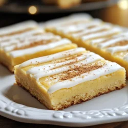 - 2 &frac12; cups all-purpose flour - 1 teaspoon baking powder - &frac12; teaspoon baking soda - &frac12; teaspoon ground nutmeg - &frac12; teaspoon ground cinnamon - &frac12; teaspoon salt - 1 cup unsalted butter, softened - 1 &frac12; cups granulated sugar - 1 large egg - 1 teaspoon vanilla extract - &frac12; cup eggnog - 1 cup powdered sugar - 2 tablespoons milk (for icing) - Extra ground nutmeg or cinnamon for garnish Using fresh spices is key for great flavor. Ground nutmeg and cinnamon add warmth. Always sift your flour to avoid lumps. Make sure your butter is soft but not melted. This helps create a light texture. You can replace eggnog with milk or a milk alternative mixed with vanilla. If you need a dairy-free option, try coconut oil instead of butter. For a gluten-free version, use a 1:1 gluten-free flour blend. {{ingredient_image_1}} 1. Preheat the Oven: Start by preheating your oven to 350&deg;F (175&deg;C). This is key to baking the bars evenly. Grease a 9x13-inch baking pan or line it with parchment paper. This makes removing the bars much easier later. 2. Mix Dry Ingredients: In a medium bowl, whisk together 2 &frac12; cups of all-purpose flour, 1 teaspoon of baking powder, &frac12; teaspoon of baking soda, &frac12; teaspoon of ground nutmeg, &frac12; teaspoon of ground cinnamon, and &frac12; teaspoon of salt. Set this bowl aside. Mixing dry ingredients now helps ensure even flavor. 3. Cream Butter and Sugar: In a large bowl, beat 1 cup of softened unsalted butter and 1 &frac12; cups of granulated sugar. Use a hand mixer or a stand mixer. Mix until it is light and fluffy, which takes about 3-4 minutes. This step adds air, making the bars soft. 4. Add Egg and Flavorings: Next, mix in 1 large egg and 1 teaspoon of vanilla extract until well combined. Then pour in &frac12; cup of eggnog and mix until the batter is smooth. The eggnog adds a rich flavor and moisture. 5. Combine Ingredients: Gradually add your dry ingredients to the butter mixture. Mix until just combined. Be careful not to overmix here. Overmixing can make the bars tough. 6. Spread the Batter: Pour the batter into the prepared baking pan. Use a spatula to spread it evenly. This ensures all bars bake uniformly. 1. Bake: Place the pan in the preheated oven. Bake for 20-25 minutes. To check if they are done, insert a toothpick into the center. If it comes out clean, the bars are ready. 2. Cooling: Once baked, allow the bars to cool in the pan for 10 minutes. After that, transfer them to a wire rack to cool completely. This step is crucial for the best texture. 1. Make the Icing: In a small bowl, whisk together 1 cup of powdered sugar and 2 tablespoons of milk until smooth. If needed, adjust the consistency by adding more milk or sugar. A good icing should be spreadable but not too runny. 2. Frost the Bars: Once the bars are completely cooled, use a spatula to spread the icing on top. This adds sweetness and makes the bars festive. 3. Garnish: For added flavor and appeal, sprinkle extra ground nutmeg or cinnamon over the frosted bars. This gives them a beautiful finish and enhances the holiday spirit. 4. Cut and Serve: Finally, cut the bars into squares and enjoy your festive treats! These Eggnog Sugar Cookie Bars are perfect for sharing with friends and family during the holidays. When making Eggnog Sugar Cookie Bars, avoid overmixing your batter. This can make the bars tough. Mix until just combined. Also, watch your baking time. If you bake them too long, they can dry out. Check them at the 20-minute mark with a toothpick. If it comes out clean, they are done. To boost the flavor, use fresh spices. Ground nutmeg and cinnamon can lose their taste over time. Grate your own nutmeg for the best result. Don't skip the eggnog; it adds moisture and flavor. Also, let the bars cool completely before icing. This helps the icing set better. For best results, use a hand mixer or stand mixer. This helps cream the butter and sugar well. A 9x13-inch baking pan is perfect for this recipe. Use parchment paper for easy removal. Finally, have a spatula on hand for spreading the batter and icing smoothly. Pro Tips Use Fresh Eggnog: For the best flavor, use fresh eggnog instead of a carton that has been sitting in your fridge for a while. Don&rsquo;t Overmix: When combining the wet and dry ingredients, mix just until incorporated to ensure your cookie bars stay tender. Cool Completely: Allow the bars to cool completely before frosting to prevent the icing from melting and sliding off. Customize Your Spices: Feel free to adjust the spices to your taste; adding a pinch of cloves or ginger can enhance the holiday flavor! {{image_2}} You can make Eggnog Sugar Cookie Bars even more fun. Try adding chocolate chips for a sweet twist. White chocolate chips work great too. You can also mix in dried cranberries or chopped nuts for a crunchy texture. Consider using flavored eggnog, like pumpkin spice or vanilla, to change the taste. Each option brings a new layer of flavor that is sure to please. While the icing in the recipe is delicious, you can switch it up. Cream cheese frosting pairs perfectly with these bars. It adds a tangy flavor that balances the sweetness well. You can also use a simple glaze made with powdered sugar and eggnog. For a festive touch, sprinkle crushed peppermint on top. This gives a holiday look and taste. If you need a gluten-free option, swap the all-purpose flour with a gluten-free blend. Make sure it works well for baking. For a dairy-free version, use vegan butter and almond or coconut milk. You can also use flax eggs instead of a regular egg. This keeps the bars tasty while fitting different diets. Enjoy these treats without worry! Store your Eggnog Sugar Cookie Bars in an airtight container. This keeps them fresh and tasty. Make sure to let them cool completely before sealing. If you stack them, place parchment paper between layers. This prevents sticking and keeps the bars nice. To freeze these bars, first cool them completely. Then, cut them into squares. Wrap each square in plastic wrap, then place them in a freezer bag. Press out as much air as you can before sealing. They will stay fresh for up to three months. When ready to enjoy, thaw them in the fridge overnight. These cookie bars stay fresh for about a week at room temperature. To keep them extra fresh, store them in the fridge. If you notice any dryness, try adding a slice of bread in the container. The bread adds moisture and can help revive the bars. Always check for any signs of spoilage before enjoying. Yes, you can make these Eggnog Sugar Cookie Bars ahead of time. They stay fresh for several days. Just bake them, let them cool, and frost them. Store them in an airtight container at room temperature. You can also freeze the bars without icing. Thaw them before serving for tasty treats. If you need a substitute for eggnog, use a mix of milk and cream. Mix one cup of milk with a tablespoon of vanilla extract and a pinch of nutmeg. This combo gives you a similar flavor. You can also use almond milk or coconut milk. Just add the same spices to get that festive taste. To check if the cookie bars are done, insert a toothpick into the center. If it comes out clean or with a few crumbs, they are ready. Bake them for 20-25 minutes. Keep an eye on them so they don&rsquo;t overbake. The edges should look lightly golden, and the center will feel set. In this post, we explored eggnog sugar cookie bars. We detailed ingredients, preparation steps, and tips for baking. You learned about common mistakes, unique flavor additions, and storage methods. Remember, using fresh ingredients can enhance flavor, and trial can help you perfect your recipe. Enjoy baking and sharing these treats. Creating these bars can bring joy and warmth to any gathering. Your family and friends will appreciate your effort!